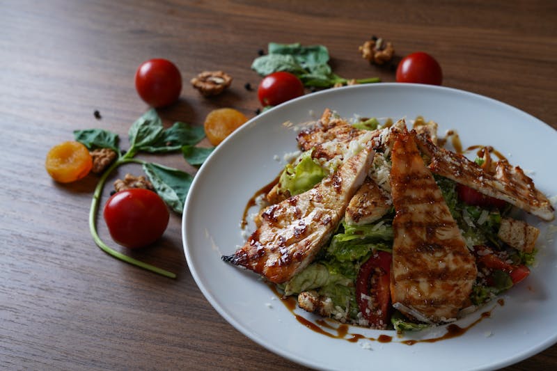 Grilled chicken salad with avocado and balsamic glaze