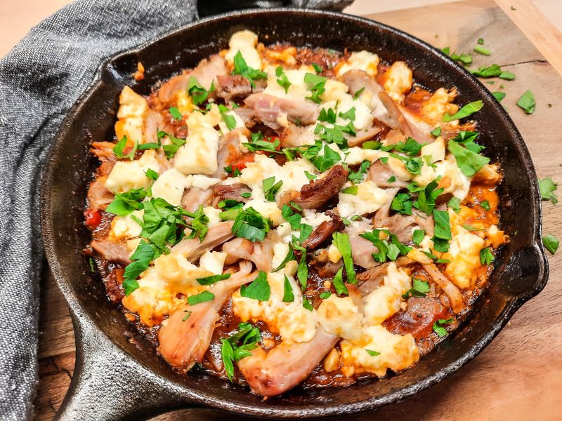 Cheesy mac and cheese side in cast iron skillet